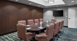 Boardroom Table With Seating for 10  and a Wall Mounted TV