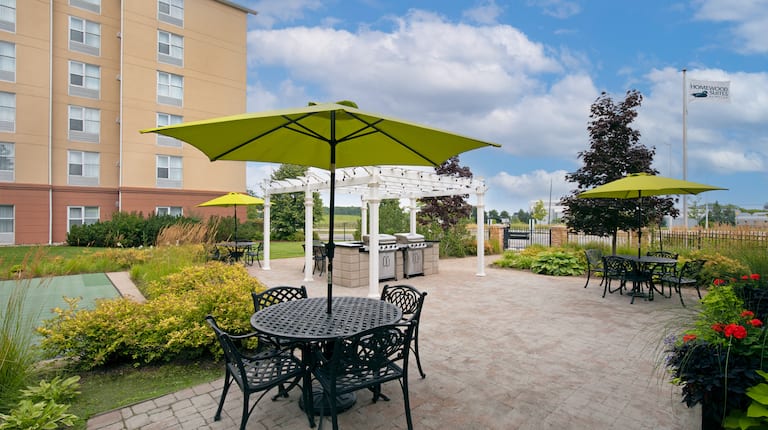 courtyard, BBQ grills, tables, chairs, umbrellas