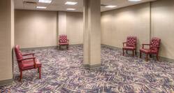 Spacious Empty Ballroom Area with Armchairs